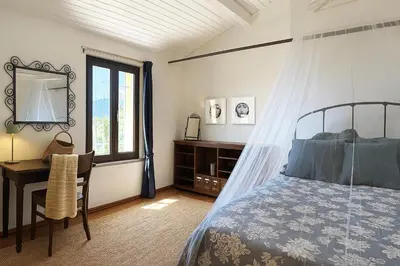 Letto o letti in una camera di Villa Garibaldino