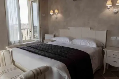 Letto o letti in una camera di Agriturismo Relais La Casina