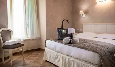 Letto o letti in una camera di Agriturismo Relais La Casina
