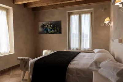 Letto o letti in una camera di Agriturismo Relais La Casina