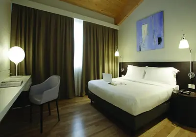 Letto o letti in una camera di Boiardo Hotel