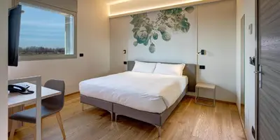 Letto o letti in una camera di Park Hotel & Residence by The Cube
