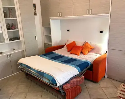 Letto o letti in una camera di Casa di Giulia, a due passi dal mare di Cavi di Lavagna