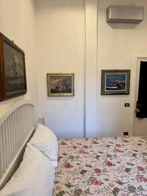 Letto o letti in una camera di lungomare portoturistico