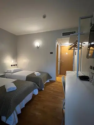 Letto o letti in una camera di Master Hotel Reggio Emilia