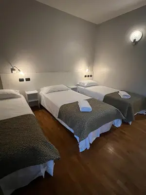 Letto o letti in una camera di Master Hotel Reggio Emilia