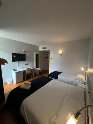 Letto o letti in una camera di Master Hotel Reggio Emilia