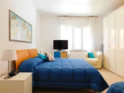 Letto o letti in una camera di Fantastico appartamento in centro, Levanto