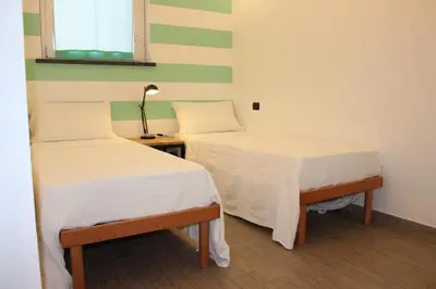 Letto o letti in una camera di CASAMIA con giardino
