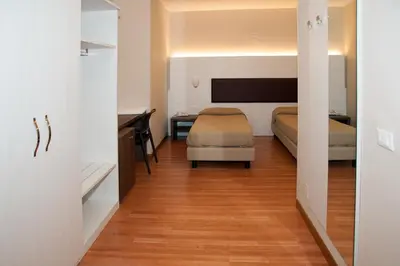 Letto o letti in una camera di HOTEL BUCA DI BACCO