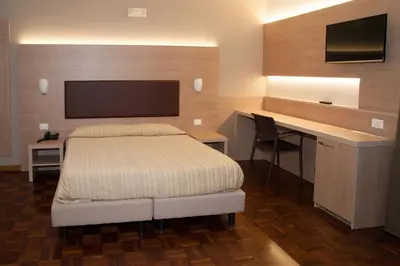 Letto o letti in una camera di HOTEL BUCA DI BACCO