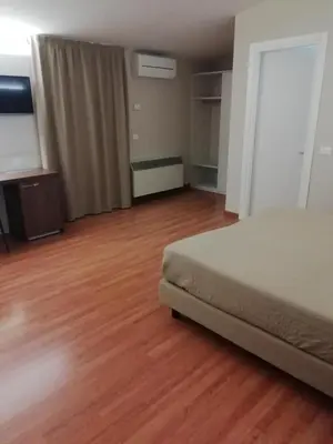 Letto o letti in una camera di HOTEL BUCA DI BACCO