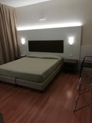 Letto o letti in una camera di HOTEL BUCA DI BACCO