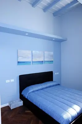 Letto o letti in una camera di MONOLOCALE VICINO MILANO 2