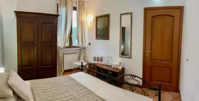 Letto o letti in una camera di CASA VACANZE MONEGLIA 2 CAMERE con TERRAZZA nel VERDE