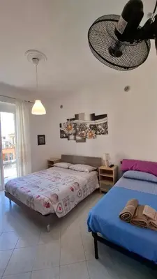 Letto o letti in una camera di Buonviaggio