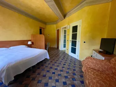 Letto o letti in una camera di Residence Corte della Vittoria