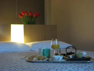 Letto o letti in una camera di Parizzi Suites&Studio Restaurant
