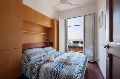 Letto o letti in una camera di Orizzonte sul mare