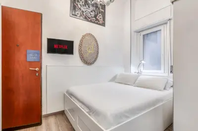 Letto o letti in una camera di ANGOLO AL PONTE micro appartamento in pieno centro