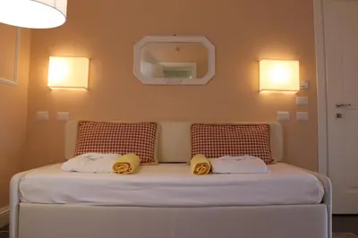 Letto o letti in una camera di Hotel Helvetia