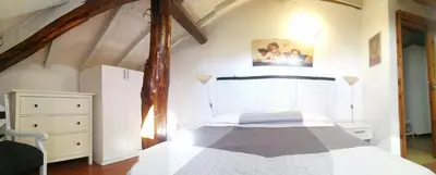 Letto o letti in una camera di DELIZIOSO ATTICO CON AMPIO TERRAZZO e GARAGE A DUE PASSI DAL MARE e DALLE CINQUETERRE LT-0485