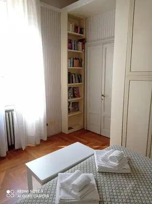 Letto o letti in una camera di B&B Palazzo Bianchi