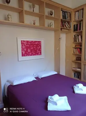 Letto o letti in una camera di B&B Palazzo Bianchi
