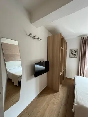 Letto o letti in una camera di Casa Dora