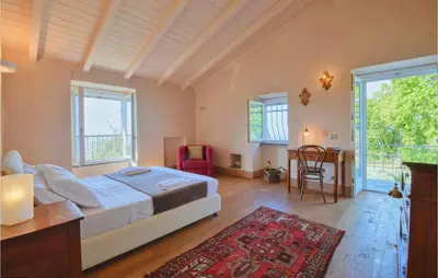 Letto o letti in una camera di S Rocco Dimora Tra Ulivi E M