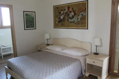 Letto o letti in una camera di Corte Nuova B&B