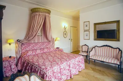 Letto o letti in una camera di Palazzo Dalla Rosa Prati