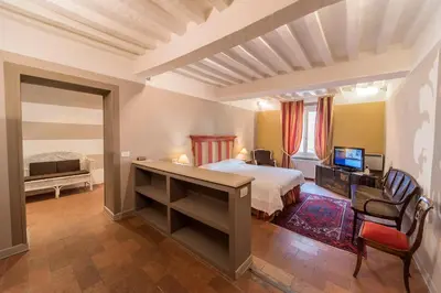 Letto o letti in una camera di Palazzo Dalla Rosa Prati