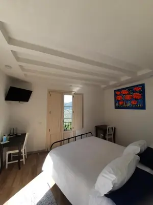 Letto o letti in una camera di B&B Cà di Bollo