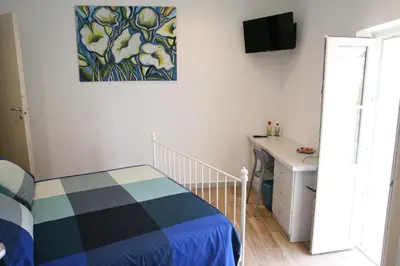 Letto o letti in una camera di B&B Cà di Bollo