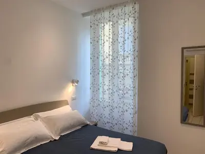 Letto o letti in una camera di Affittacamere Sapore di Mare