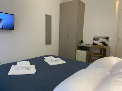 Letto o letti in una camera di Affittacamere Sapore di Mare