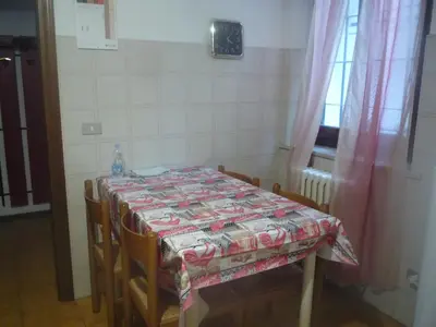 Letto o letti in una camera di Stanza in appartamento condiviso nel centro storico di Parma