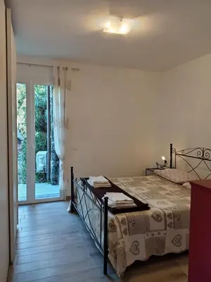 Letto o letti in una camera di Appartamento Taggiasca con piscina - Riva Trigoso