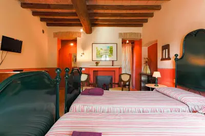 Letto o letti in una camera di AGRITURISMO LE CORTI DELLA GUALDANA