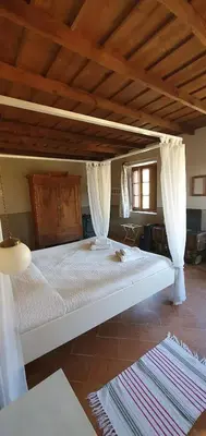 Letto o letti in una camera di AGRITURISMO LE CORTI DELLA GUALDANA