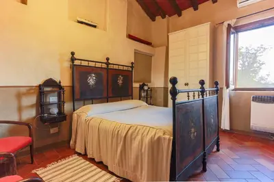 Letto o letti in una camera di AGRITURISMO LE CORTI DELLA GUALDANA