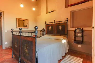 Letto o letti in una camera di AGRITURISMO LE CORTI DELLA GUALDANA