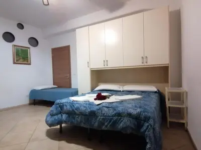 Letto o letti in una camera di Villa Glori affitto camere monolocali