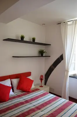 Letto o letti in una camera di B&B Archi di Borgolungo