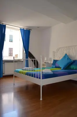 Letto o letti in una camera di B&B Archi di Borgolungo