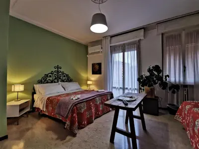 Letto o letti in una camera di B&B Ospedale Maggiore Parma affittacamere