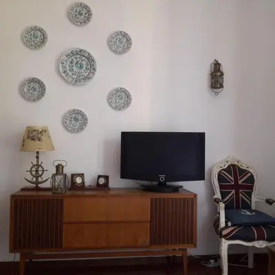 TV o dispositivi per l'intrattenimento presso Elegant and Sea View Excelsior Apartment