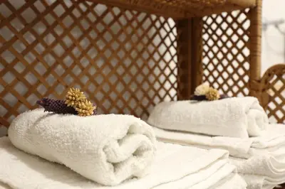 Letto o letti in una camera di B&B L'uva Fragolina