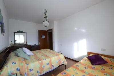 Letto o letti in una camera di B&B L'uva Fragolina